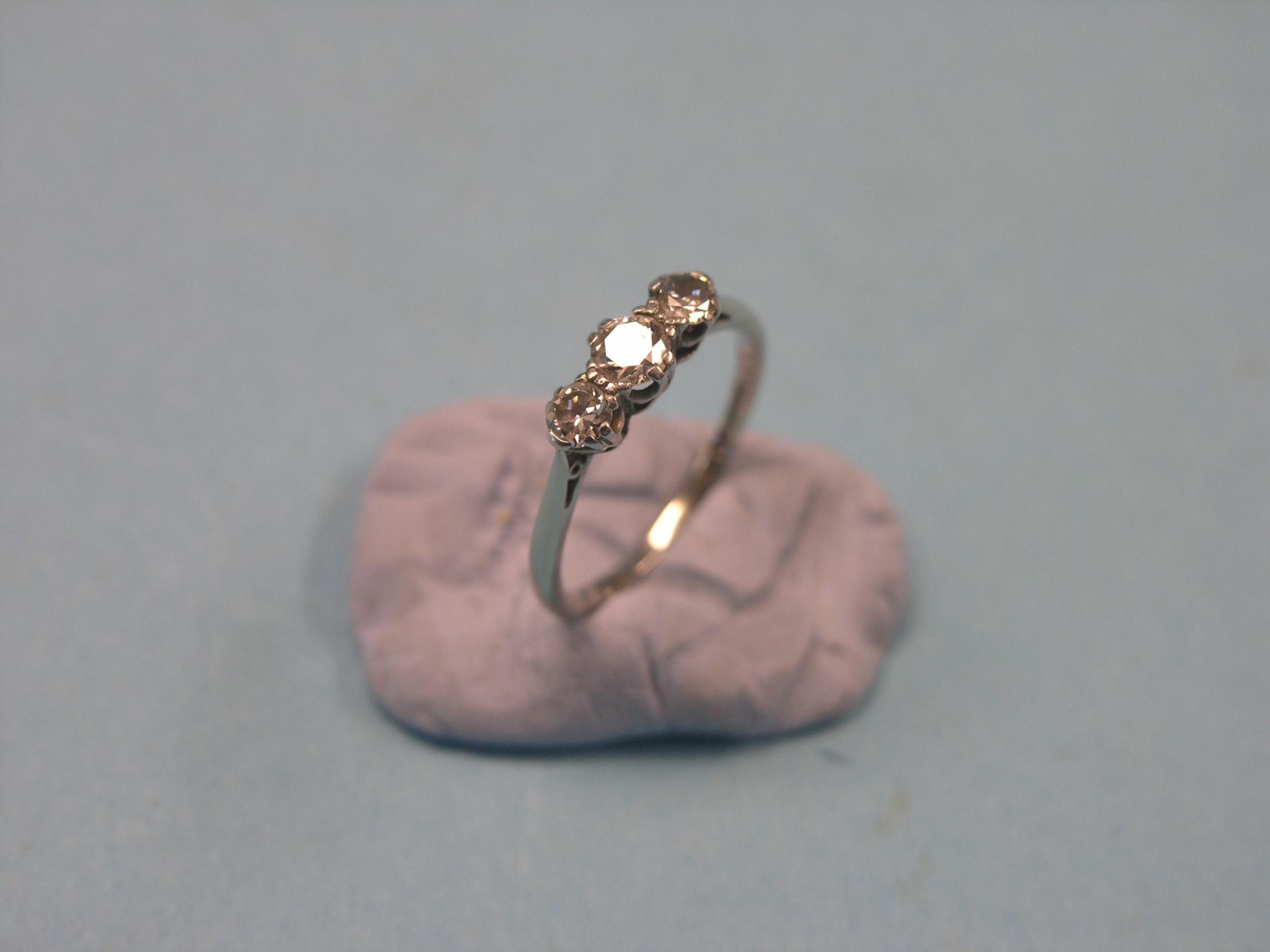 Appraisal: An ct gold and diamond half-hoop ring three stones within