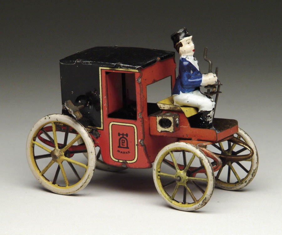 Appraisal: LEHMANN MOTOR CAR Has hand painted figure lithographed car and