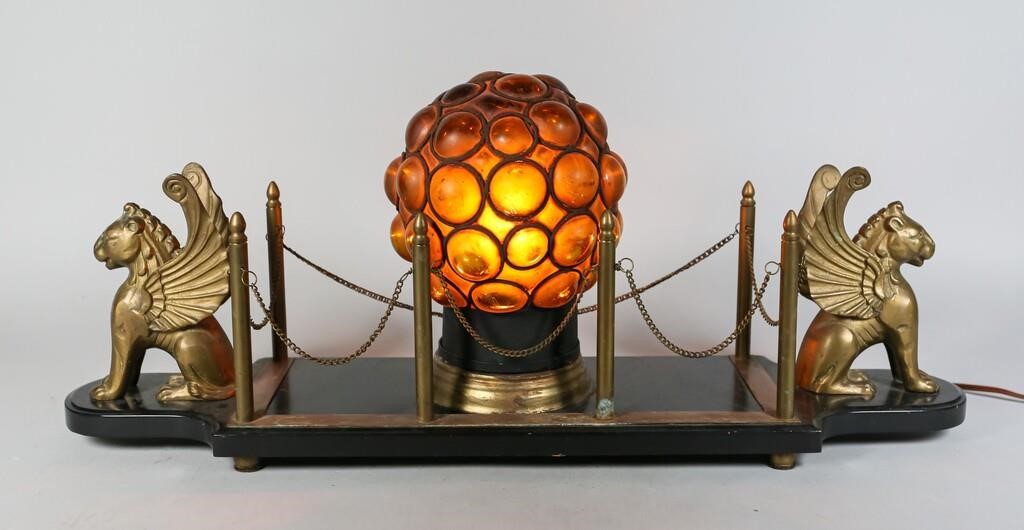 Appraisal: Art Deco caged amber glass lamp mounted on a hardstone