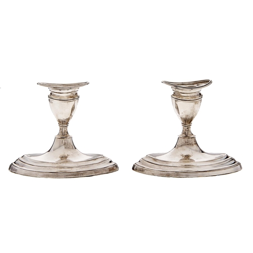 Appraisal: A pair of Edwardian silver dwarf navette shaped candlesticks nozzles