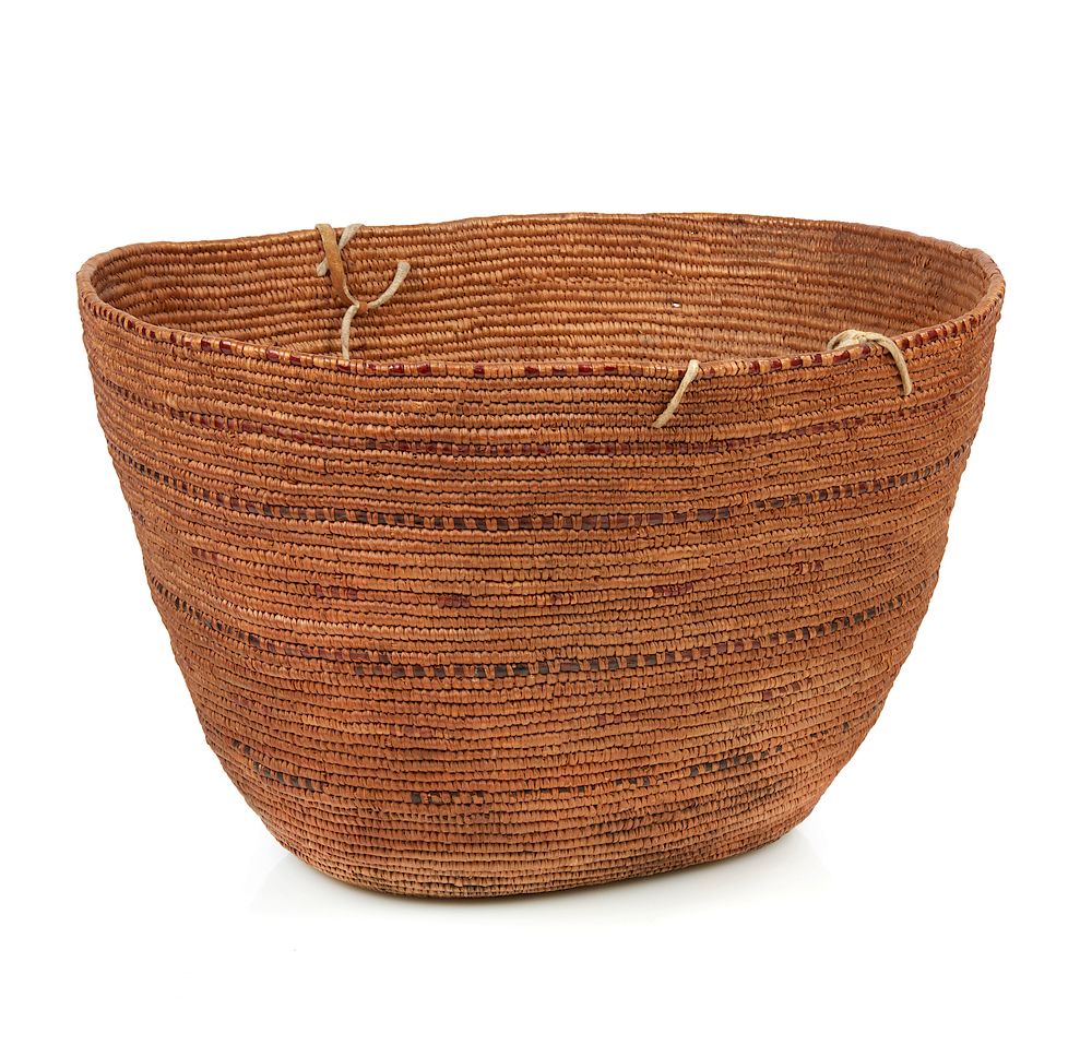 Appraisal: Northwest Basket Large oval Northwest basket with hide strip handles