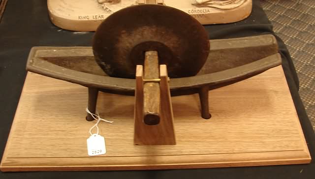 Appraisal: Circular chopping blade in boat-form base mounted on wooden base