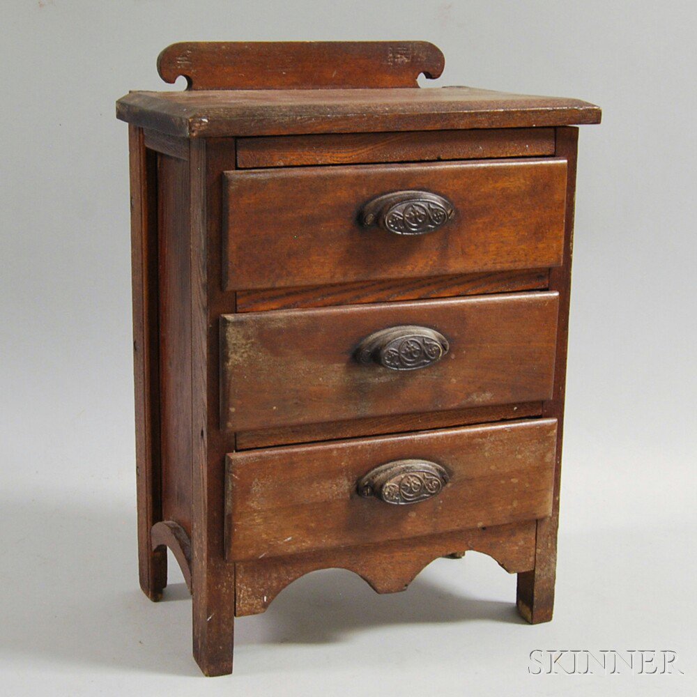 Appraisal: Miniature Oak Three-drawer Dresser with stamped metal hardware nailed drawers