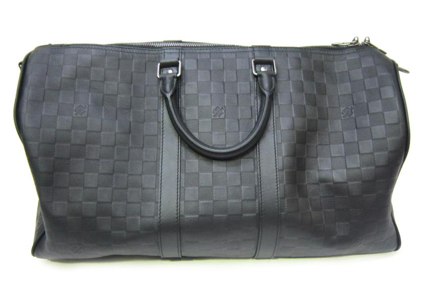 Appraisal: A LOUIS VUITTON KEEPALL TRAVEL BAG IN DAMIER CARBONE CANVAS