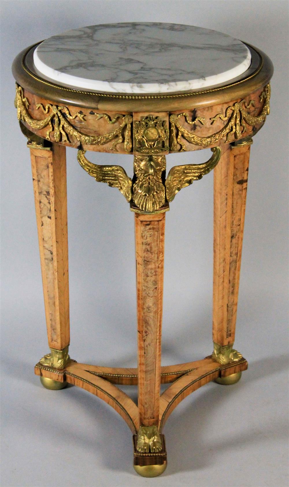 Appraisal: GUERIDON STYLE MARBLE TOPPED ROUND TABLE WITH EGYPTIAN REVIVAL BRASS