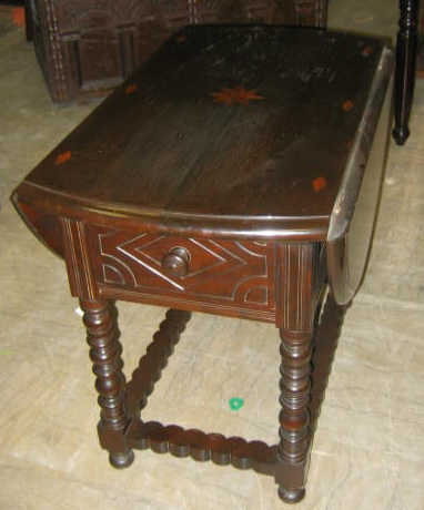 Appraisal: PILGRIM STYLE WALNUT AND INLAID DROP LEAF TABLE Molded top