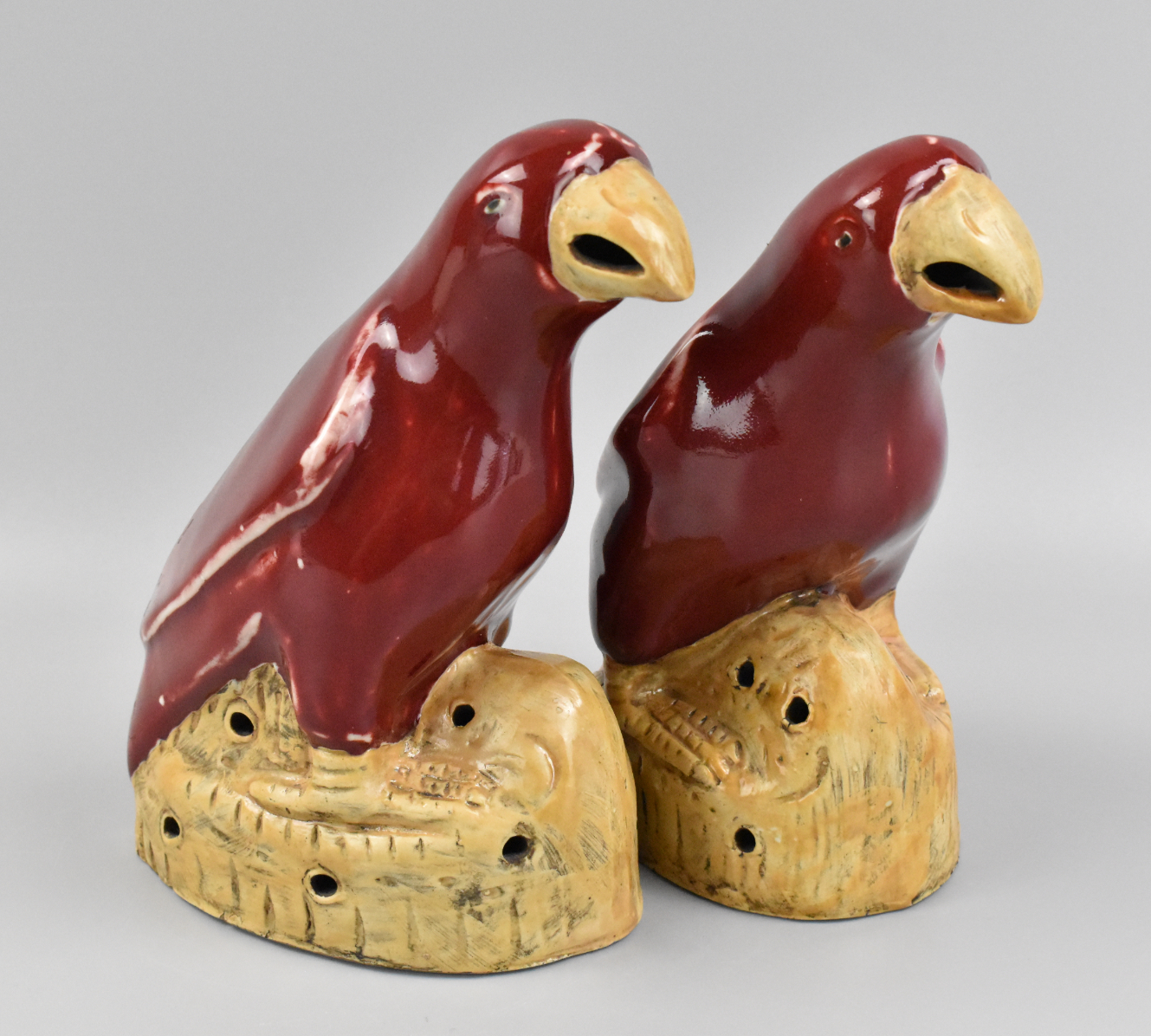 Appraisal: A pair of Chinese red glazed parrots dating from the