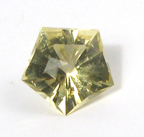 Appraisal: UNSET GOLD BERYL GEMSTONE The pentagon-cut gold beryl weighs cts