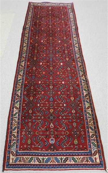 Appraisal: PERSIAN TRIBAL RUNNER Hamadan region northwest Iran Herati floral motif