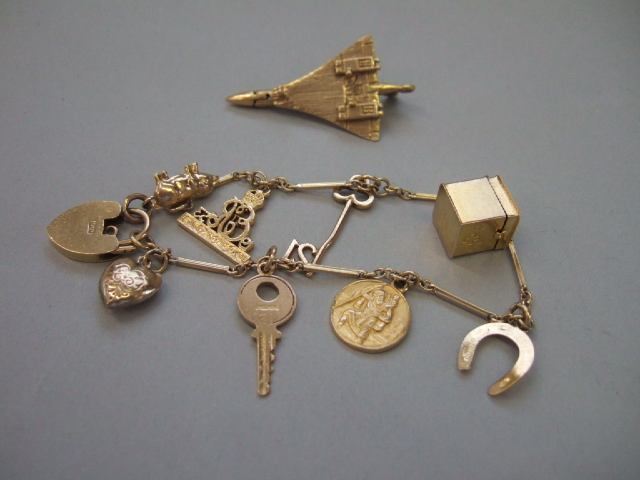 Appraisal: A ct gold Concorde charm and a gold baton link