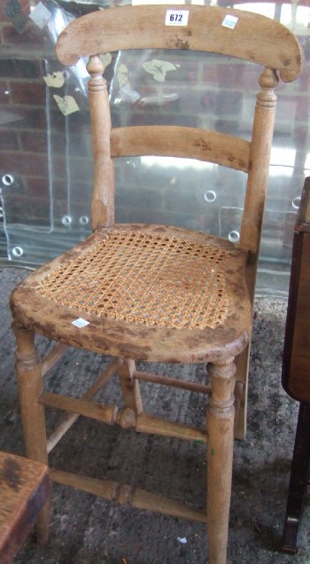 Appraisal: A Victorian beech childs high correction chair with a split