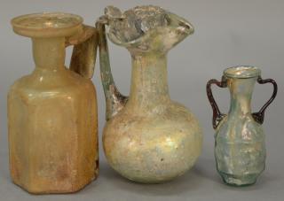 Appraisal: Three Roman glass jugs with handles including pale green clear