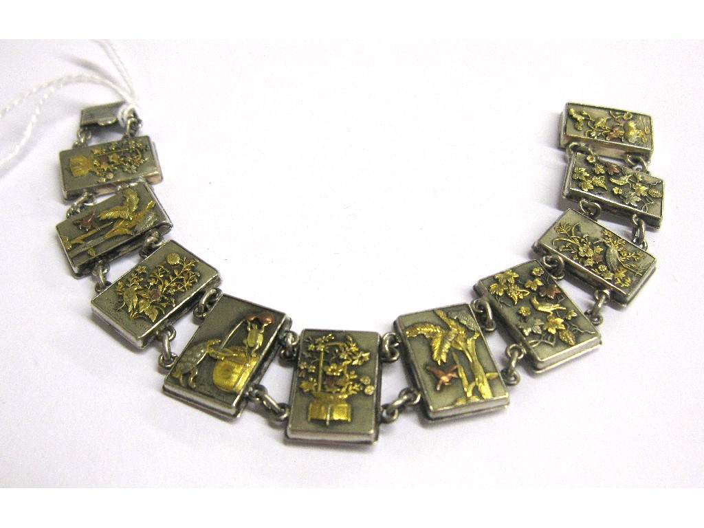 Appraisal: Japanese bracelet made up of silver plaques with gold onlay