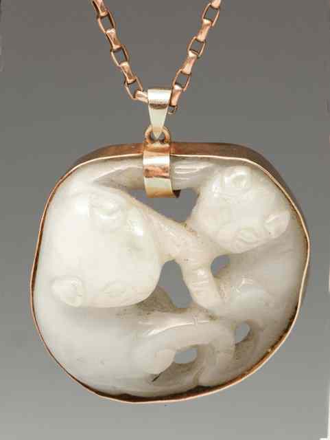 Appraisal: A CHINESE WHITE JADE PENDANT carved in the form of