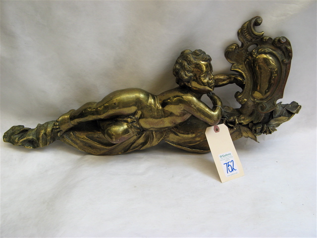 Appraisal: FRENCH TH CENTURY GILT BRONZE reclining putti holding a baroque-shield