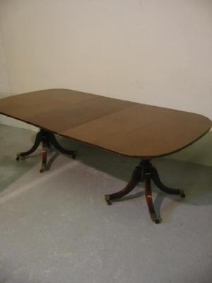 Appraisal: A MAHOGANY D ENDED DINING TABLE of rounded oblong form