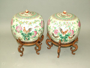 Appraisal: A pair of Chinese porcelain famille rose ginger jars and