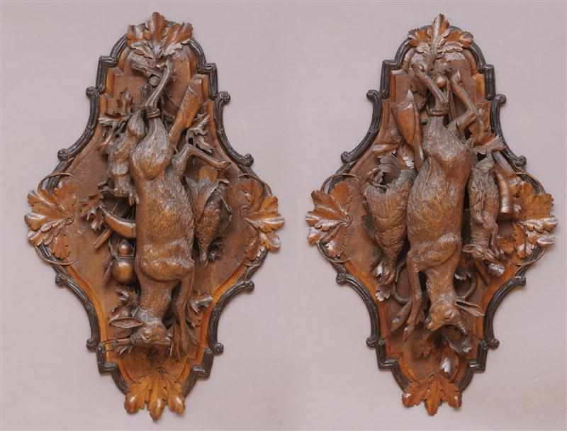 Appraisal: PAIR OF GERMAN BLACK FOREST CARVED WALNUT HUNT TROPHIES Each