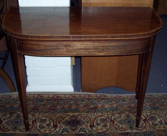 Appraisal: A George III mahogany card table crossbanded and strung with