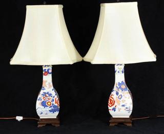 Appraisal: Pair of English ironstone Imari bottle form vases and stoppers