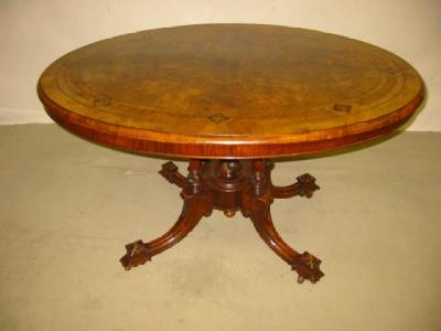 Appraisal: A VICTORIAN WALNUT LOO TABLE the quarter veneer burr top