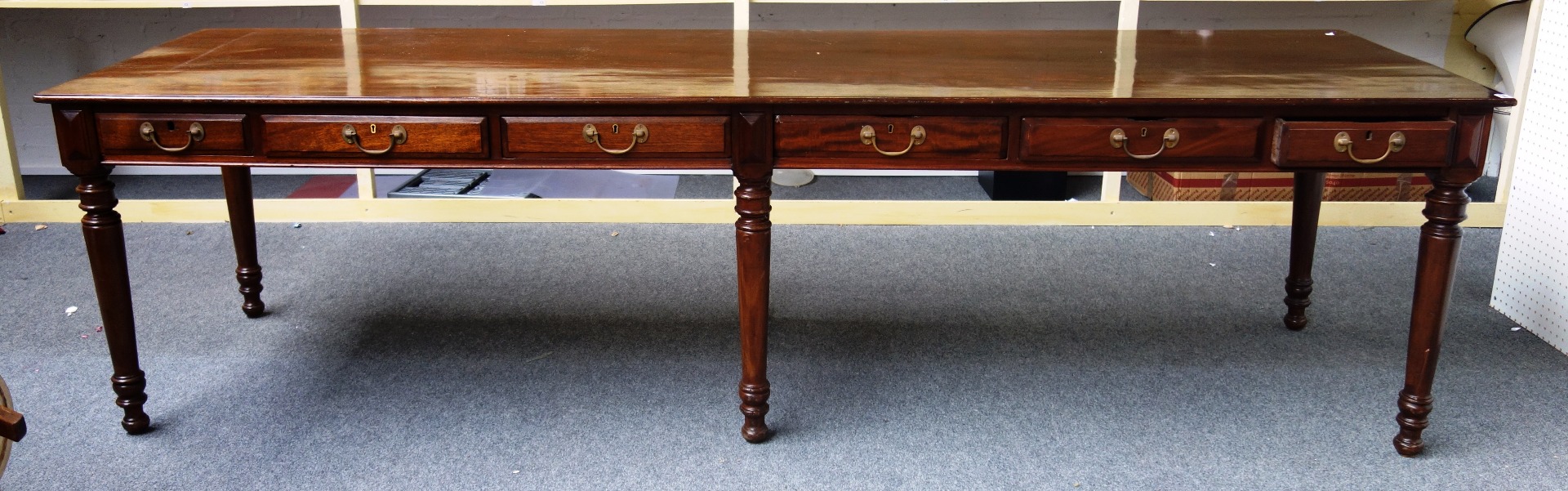 Appraisal: A th century mahogany preparation table the rectangular top over