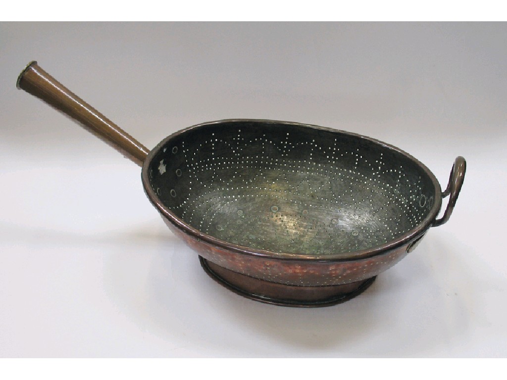 Appraisal: A VICTORIAN COPPER LONG HANDLED COLANDER the tapering handle and