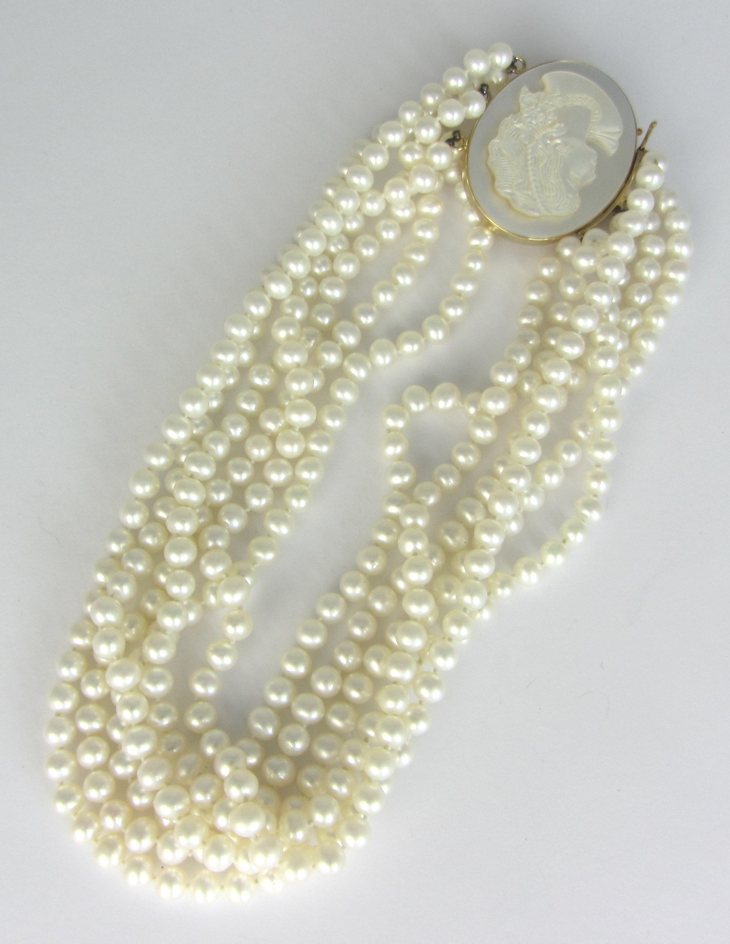 Appraisal: A six row necklace of cultured pearls on an oval