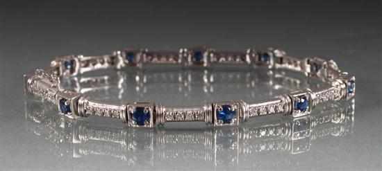 Appraisal: K white gold diamond and sapphire flexible link bracelet approximately