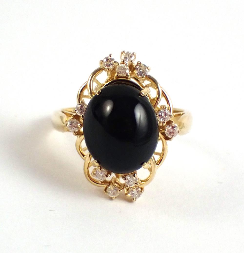 Appraisal: BLACK ONYX DIAMOND AND FOURTEEN KARAT GOLD RING with twelve