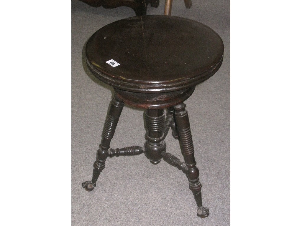 Appraisal: Rise and fall piano stool on ball and claw feet