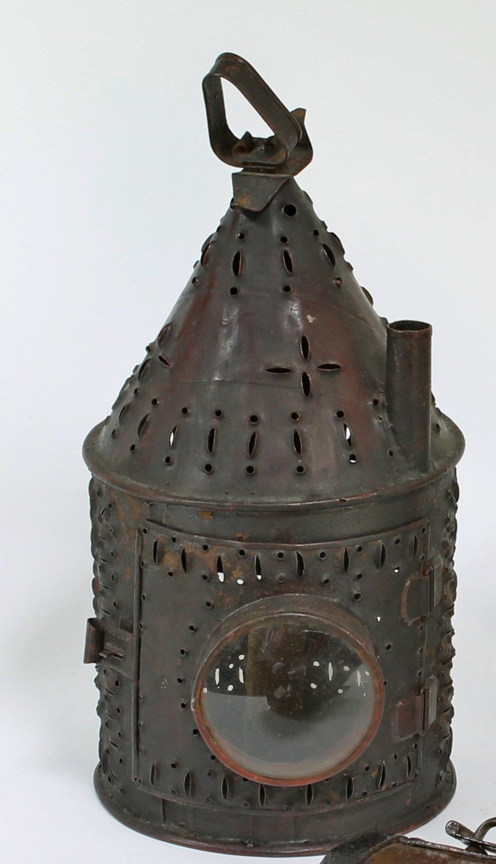 Appraisal: A pierced conical iron lantern with bullseye glass cm high