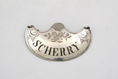 Appraisal: A late th century silver wine label of arched crescent