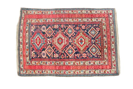 Appraisal: ORIENTAL RUG Early th century Kuba Dark blue field with