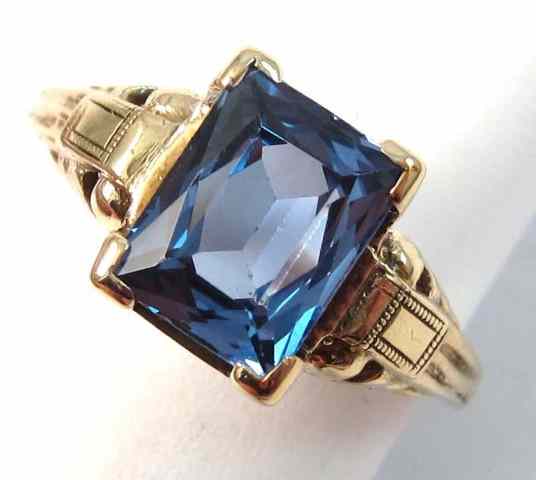 Appraisal: SYNTHETIC BLUE SPINEL AND TEN KARAT GOLD RING four gold