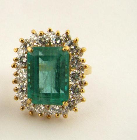 Appraisal: K yellow gold ring with emerald cut emerald center stone