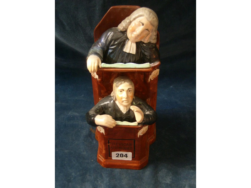 Appraisal: A th century Staffordshire group The Vicar and Moses with