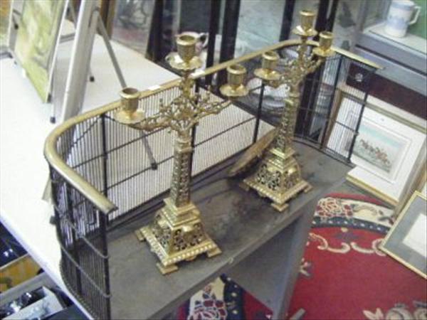 Appraisal: A pair of gilt brass three branch candlesticks a fire