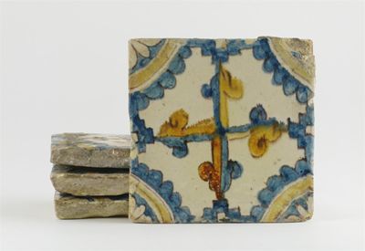 Appraisal: Four Continental tin-glazed tiles painted with stylized crosses in shades