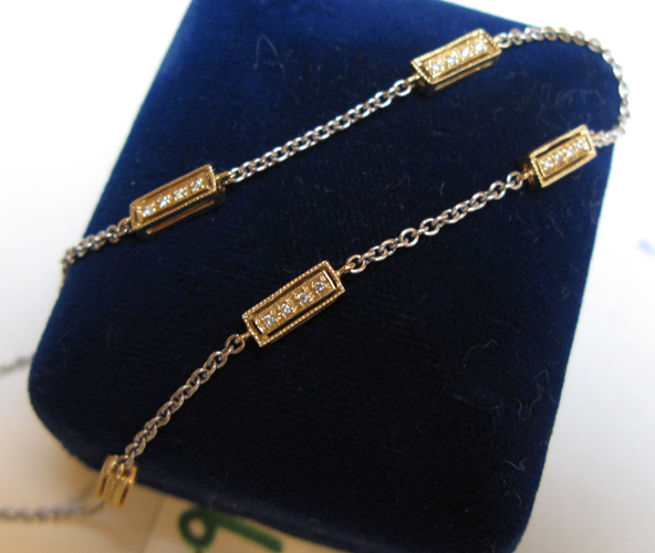 Appraisal: DIAMOND AND FOURTEEN KARAT WHITE AND YELLOW GOLD CHAIN NECKLACE