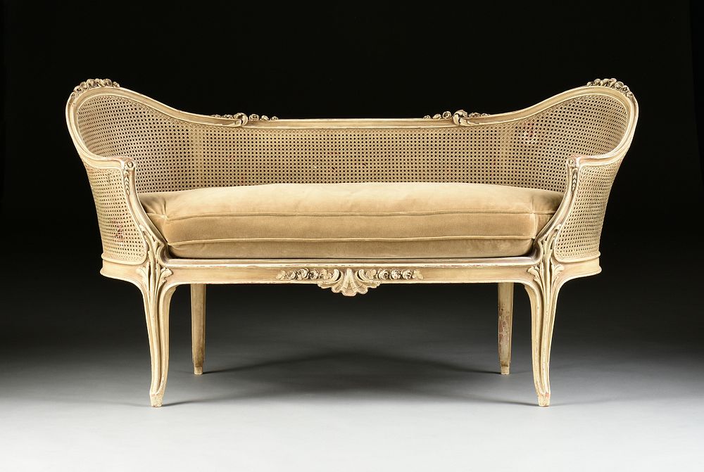 Appraisal: A LOUIS XV REVIVAL CANED AND PAINTED WOOD CANAP FIRST