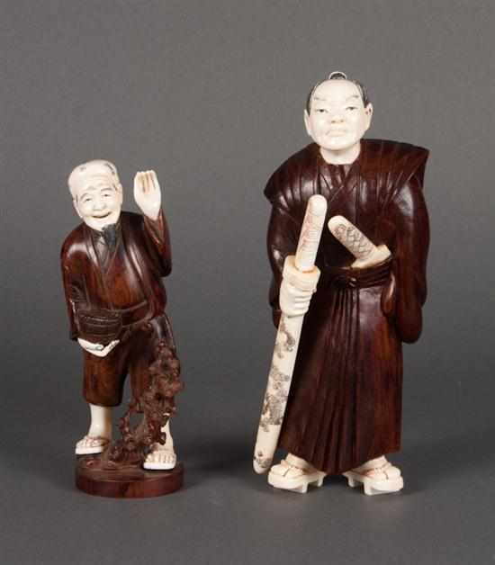 Appraisal: Two Japanese carved wood and ivory figures - Samurai warrior