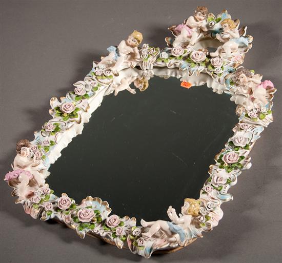 Appraisal: Continental porcelain mirror in the Meissen manner with applied putti