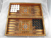 Appraisal: An inlaid games box opening as a backgammon board inside