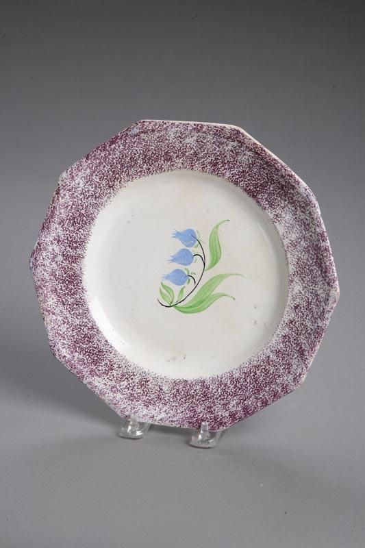 Appraisal: PURPLE SPATTERWARE PLATE English st half- th century Paneled plate