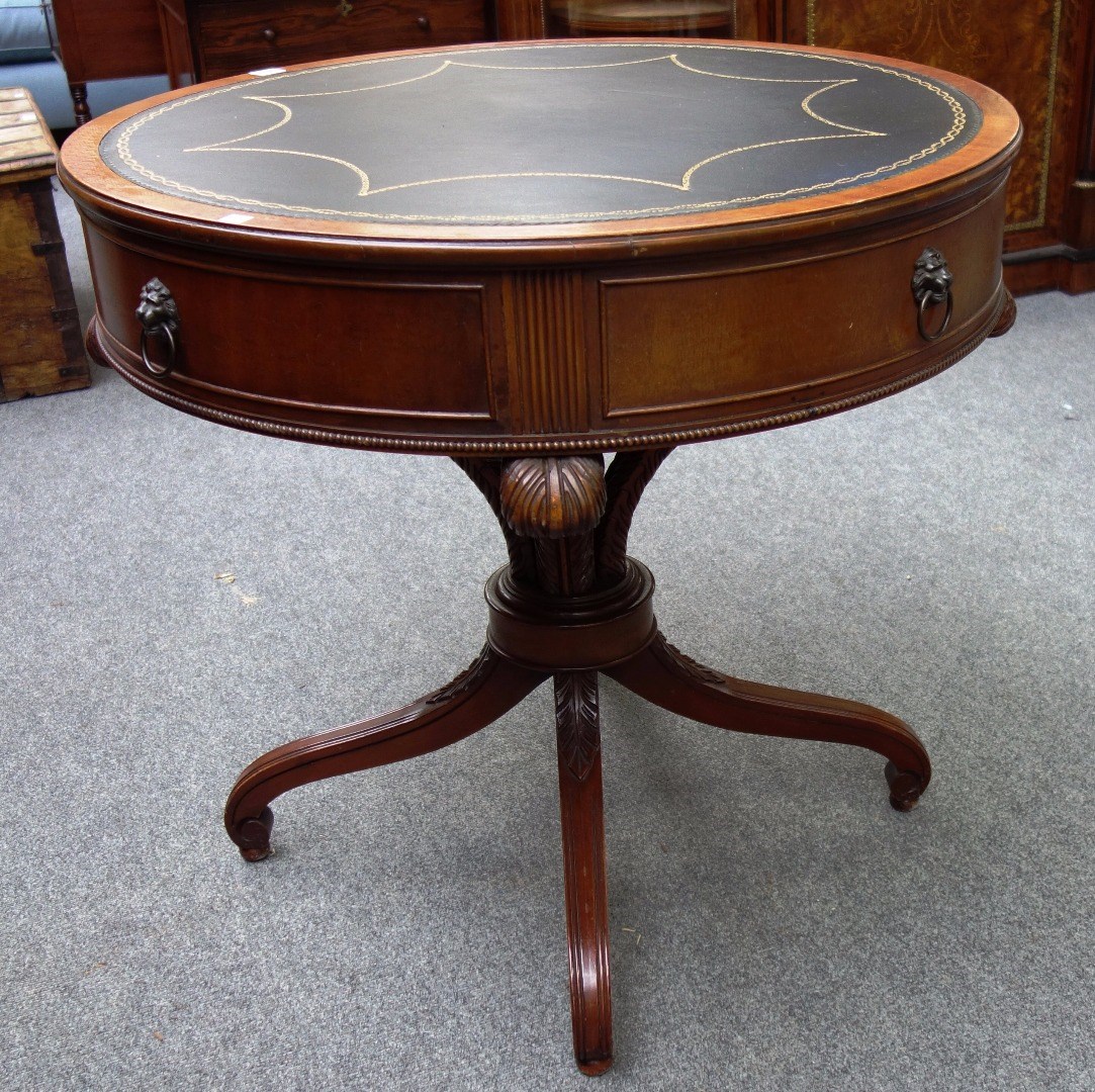 Appraisal: A Regency design drum centre table with single frieze drawer