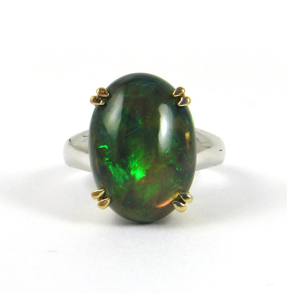 Appraisal: BLACK OPAL AND FOURTEEN KARAT GOLD RING The k white