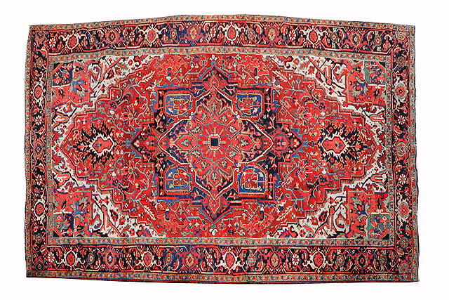 Appraisal: A HEREZ MID RED GROUND CARPET the central large medallion