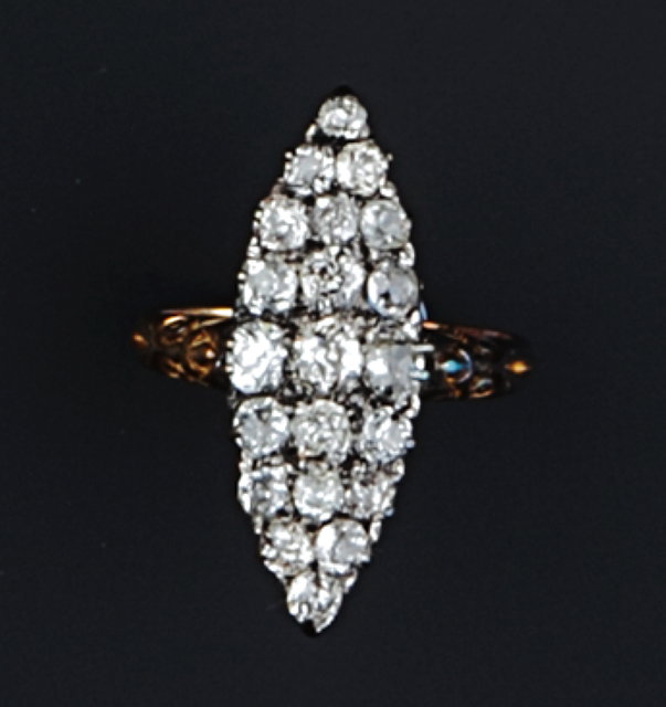 Appraisal: A NAVETTE-SHAPED DIAMOND PANEL RING set with graduated old and