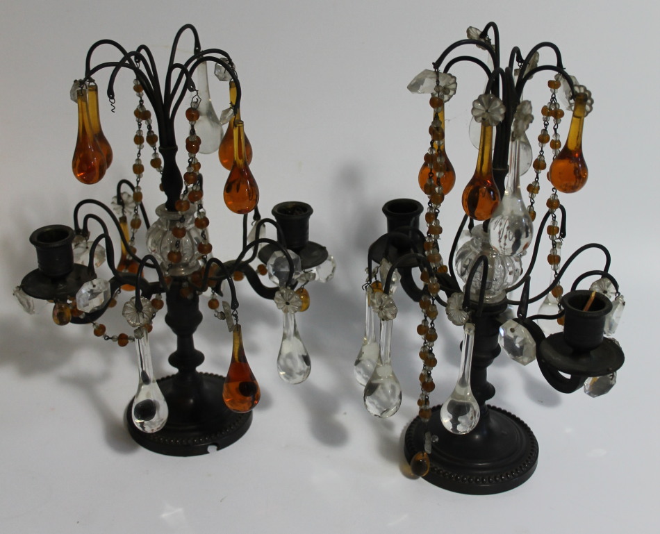 Appraisal: A pair of thC bronze and glass two branch candlesticks